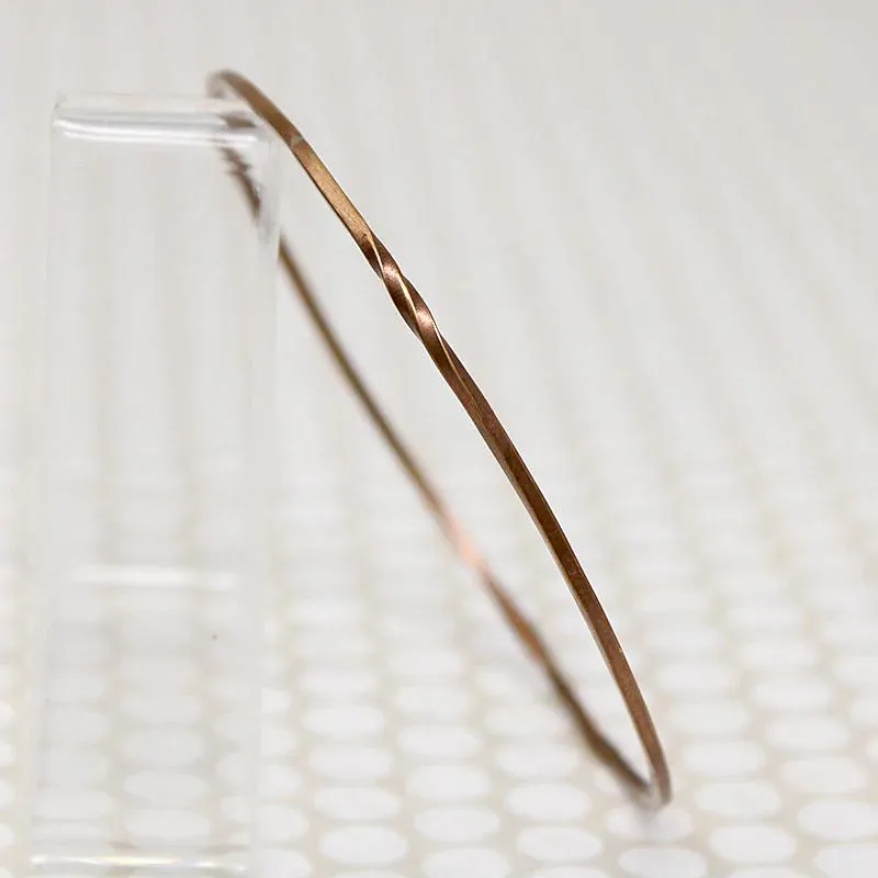 The Endless Twist Round Bangle in Bronze from Allie B.