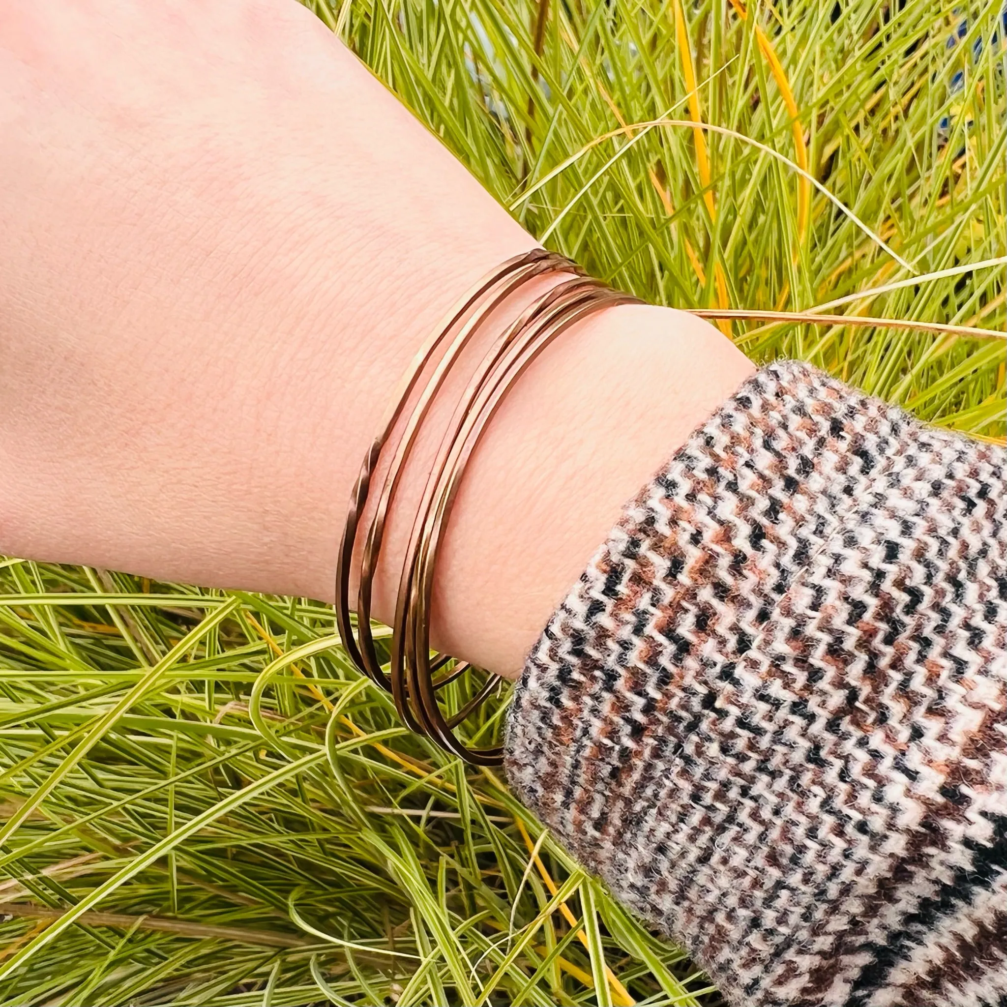 The Endless Twist Round Bangle in Bronze from Allie B.